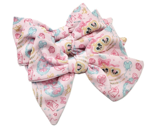 Small pink happiest place hair bow